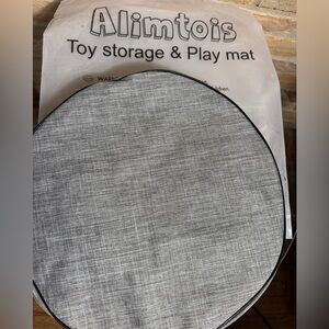 New -Toy storage, play and carry mat. Gray  drawstring Mat attached to bag..